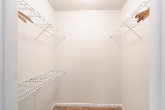 Walk-in closet at Landing at Willow Bayou Apartment Homes in Bossier City, LA