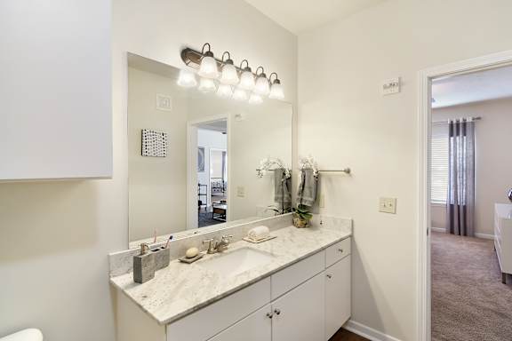 Granite countertops in bathroom and kitchen at Landing at Willow Bayou Apartment Homes in Bossier City, LA