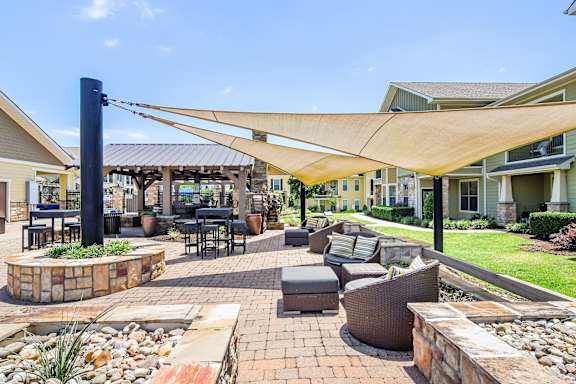 a yellow house with a sidewalk in front of it  at Wellington Grande Apartment Homes, Texas, 75605