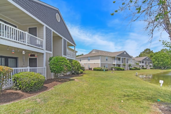 community with houses and a pondat The Pointe Apartment Homes, Gautier, Mississippi, 39553