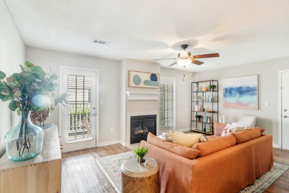 a living room with a couch and a ceiling fan at Reserve of Jackson Apartment Homes, Jackson
