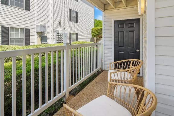 a patio with two chairs and a table on a balcony at Reserve of Jackson Apartment Homes, Jackson, 39211