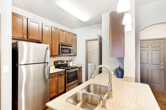 a kitchen with stainless steel appliances and granite counter tops at kingston crossing apartment homes in bossier city la  at Kingston Crossing Apartment Homes, Louisiana, 71111