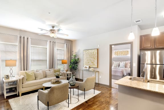 a living room with a couch and a table  at Kingston Crossing Apartment Homes, Bossier City, LA