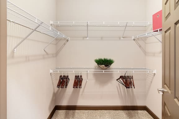our spacious walk in closets stocked with clothes hanger at kingston crossing apartment homes in bossier city la at Kingston Crossing Apartment Homes, Bossier City