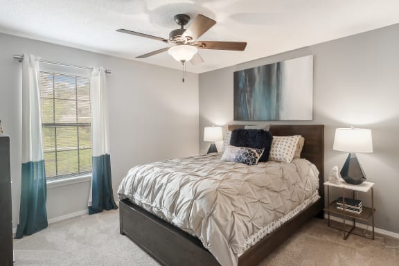 a bedroom with a bed and a ceiling fan at parkwest apartment homes in hattiesburg ms at Parkwest Apartment Homes, Hattiesburg, 39402