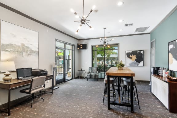 a living room with a dining room table and a balcony at Highpointe Apartment Homes, Brandon, 39042
