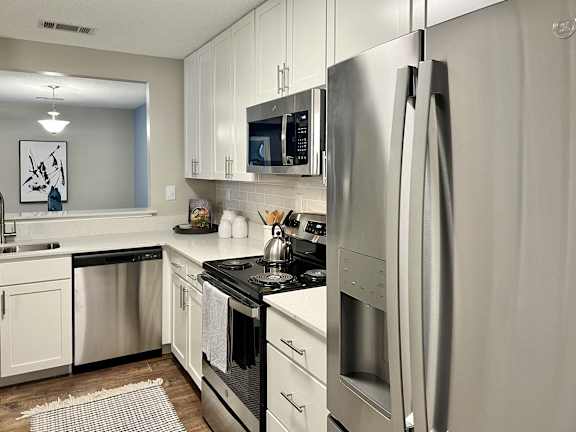 A modern kitchen with stainless steel appliances at Reserve at Park Place Apartments, Hattiesburg