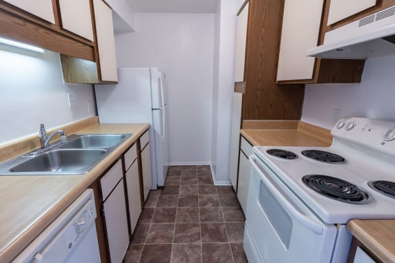 Kitchen With White Appliances at Crestview at Louisville Apartments, Kentucky, 40217