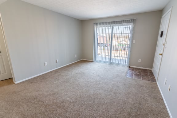 Living Area With Balcony at Crestview at Louisville Apartments, Kentucky