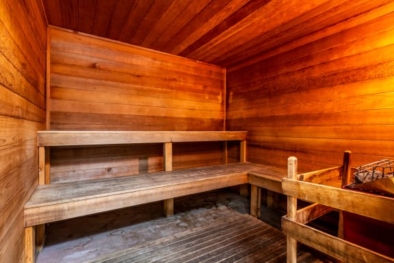 a sauna with wooden benches and wooden walls