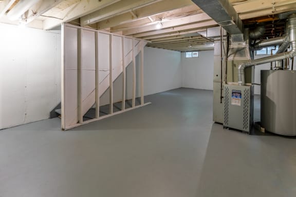 a room with a staircase in the middle of it