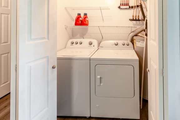 the washer and dryer in the laundry room of a home