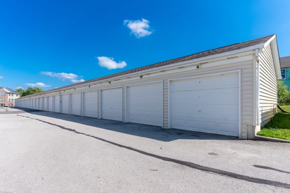 a large white garage with a long row of doors