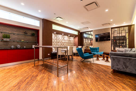 Lounge Area With TV at Somerset Place Apartments, Chicago, IL, 60640