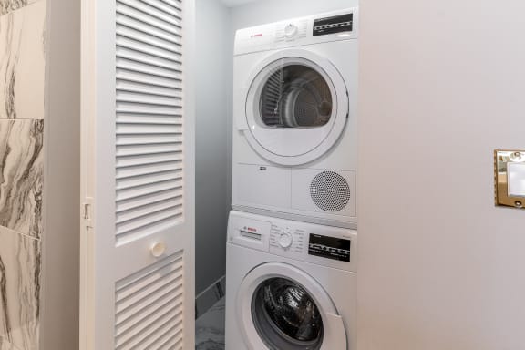 a small laundry room with a washing machine and a dryer