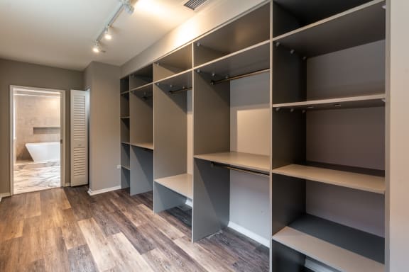 a walk in closet in a new home