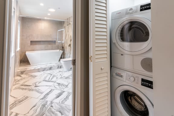 a small laundry room with a washer and dryer
