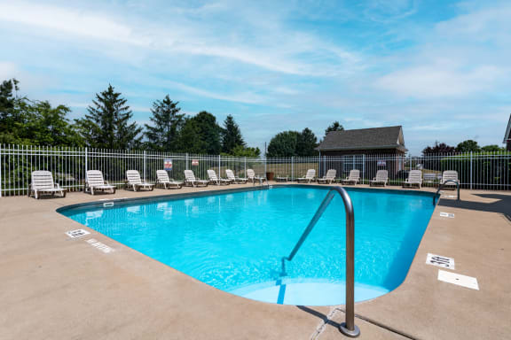 Large swimming pool with sundeck seating at Barton Farms in Greenwood, IN