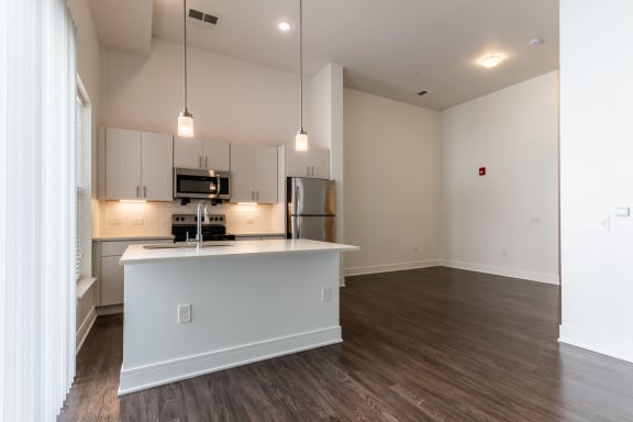 Luxury wood-style plank flooring at The Whit Apartments in Indianapolis, IN 46204