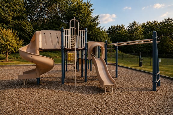 A playground with a slide, swings, and a climbing structure.