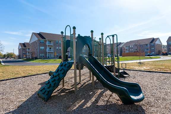 Playground With Slide at The Village at Sandstone Apartments, Indiana, 46142