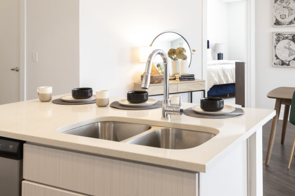 Pull down kitchen faucet with chrome finish at The Whit Apartments in Indianapolis, IN 46204