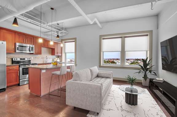 Floor Plan  living room with a couch and a table at 100 South Apartments, Buffalo, NY 14202