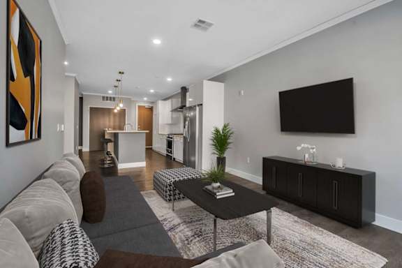Contemporary living room with wall mounted television at Nineteen North Apartments, Buffalo, 14202