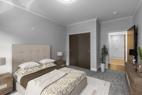 a bedroom with a bed and a door to a bathroom a bedroom with a bed and a door to a bathroom at Nineteen North Apartments , Buffalo, 14202