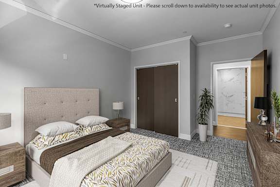 a bedroom with a bed and a door to a bathroom at Nineteen North Apartments , Buffalo, 14202