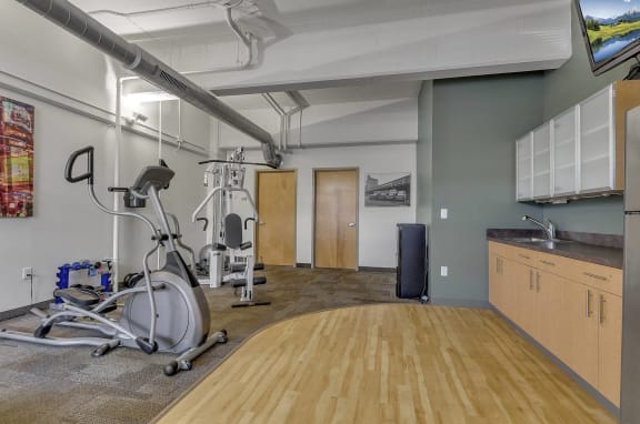 Gym with a exercise bike at The Lofts at Elk Terminal, Buffalo, NY, New York