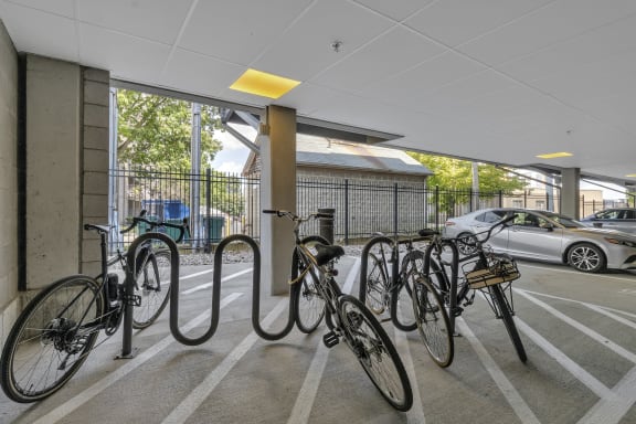 a row of bikes parked inside of a parking garage at Nineteen North, Buffalo