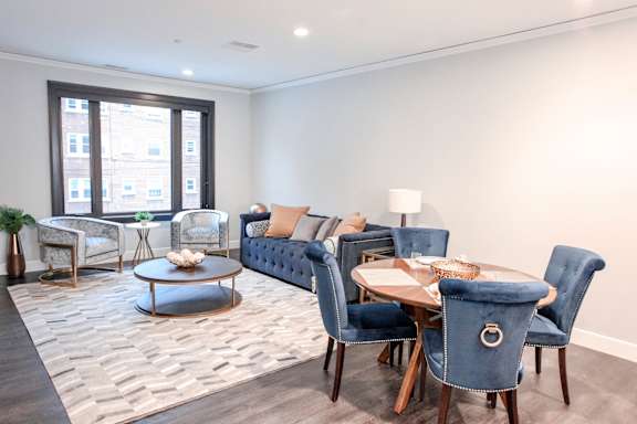 a living room with couches and chairs and a table at Nineteen North Apartments , Buffalo, New York