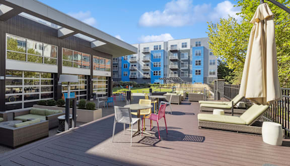 a rendering of a rooftop patio with tables and chairs at Bakery Living in Pittsburgh, PA 15206