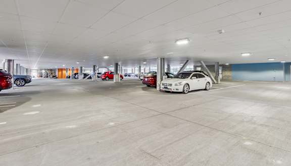 an empty parking garage with cars parked in it Hot Metal Flats apartments, Southside Pittsburgh, PA