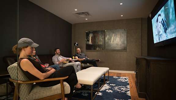 a group of people sitting in a room watching a movie at Bakery Living, Shadyside, Pittsburgh, PA 15206