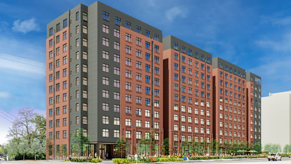A large multi-story building with a red and grey facade.