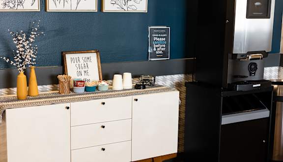 a kitchen with white cabinets and a blue wall at Walnut Crossings, Monroeville, PA, 15146