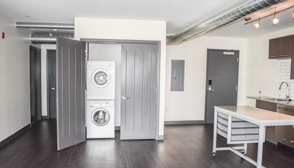 a room with a washer and dryer in it