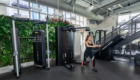 a fully equipped gym with exercise equipment at The Washington at Chatham, Pittsburgh, PA 15219