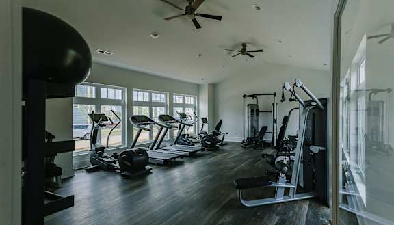 a gym with a lot of exercise equipment at Highland Village, Pittsburgh, PA