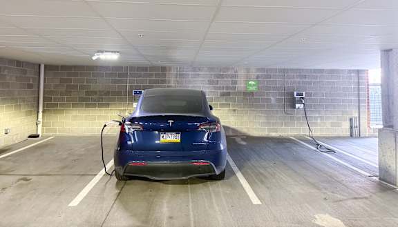 a car is plugged into a battery charger in a parking garage Hot Metal Flats apartments, Southside Pittsburgh, PA