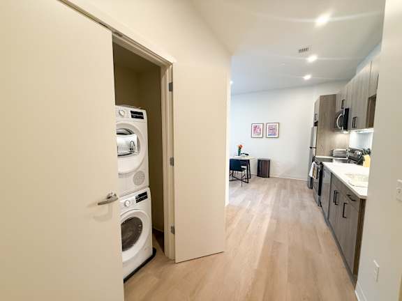 A laundry room with a washer and dryer in it.