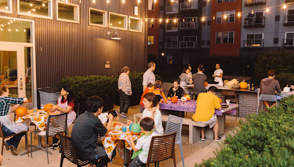 a group of people sitting at a table in front of a building at Bakery Living, Shadyside, Pittsburgh, PA 15206