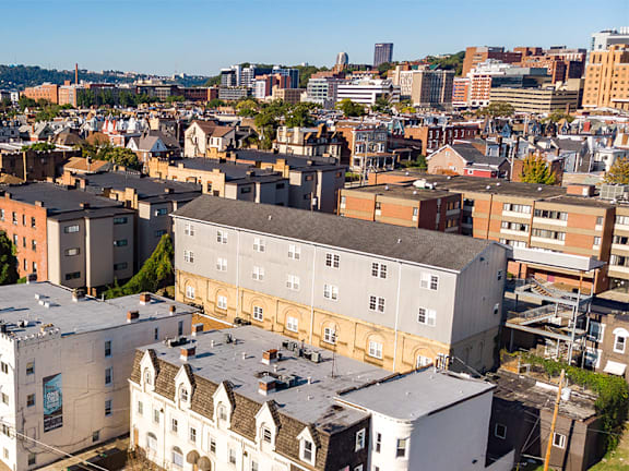 A cityscape with buildings of various designs and sizes.