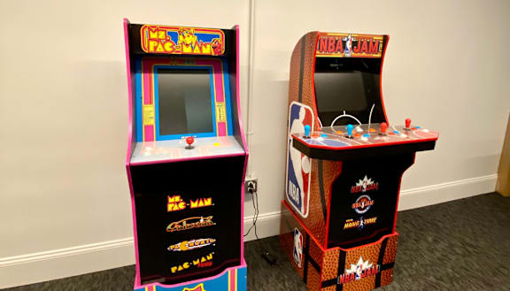 two arcade game machines next to each other in a room at The Washington at Chatham, Pittsburgh, PA 15219