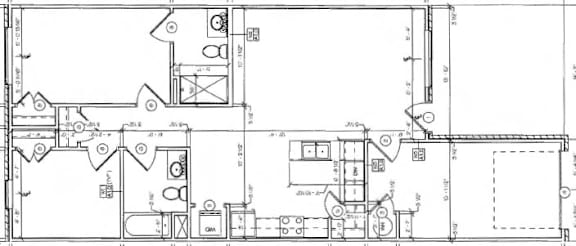 A detailed floor plan of a building with labeled rooms and measurements.