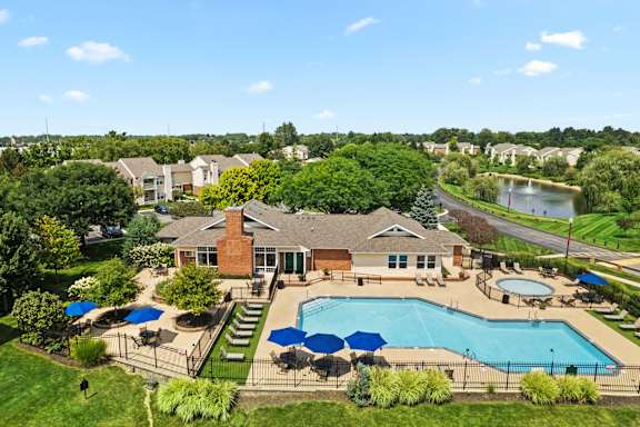 A large house with a pool in the backyard.