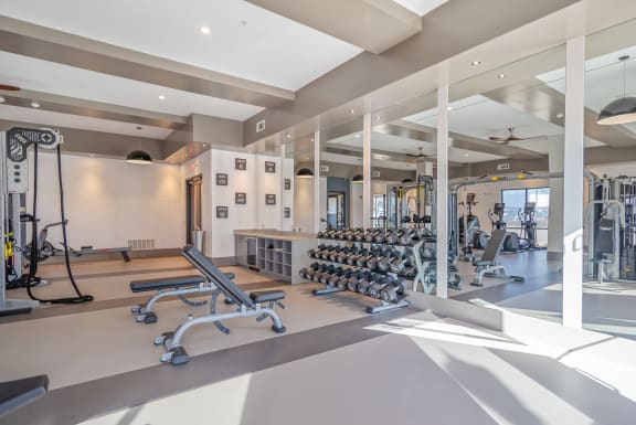 a gym with weights and cardio equipment at the clubhouse at the resort at governors crossing